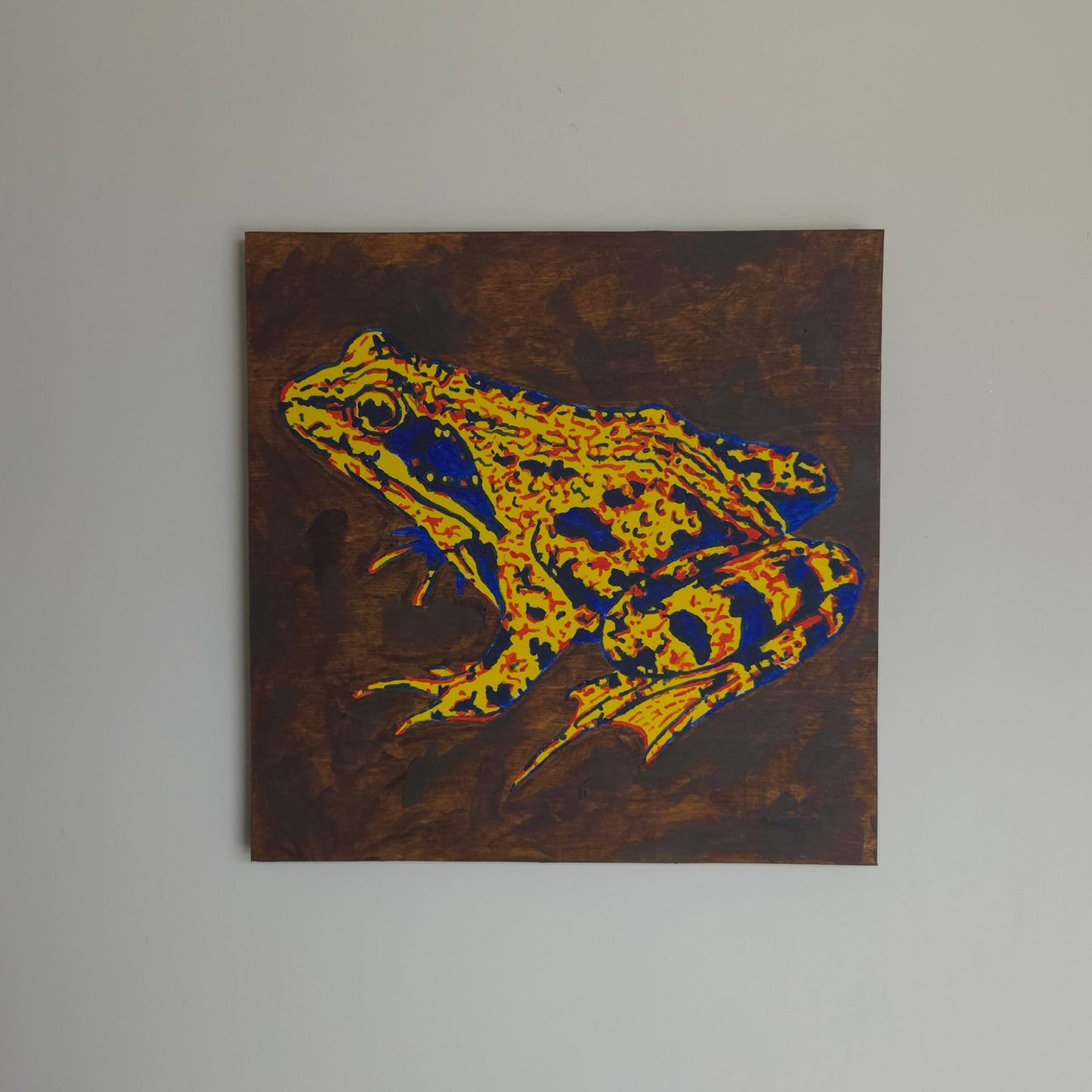 original acrylic painting on wooden cradle board in red, yellow and blue depicting a frog.